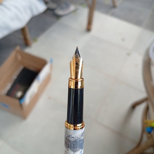 Pens in like-new condition with various designs