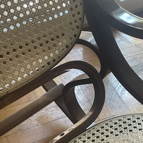 Wooden rocking chair with cane seat, walnut finish