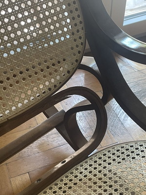 Wooden rocking chair with cane seat, walnut finish