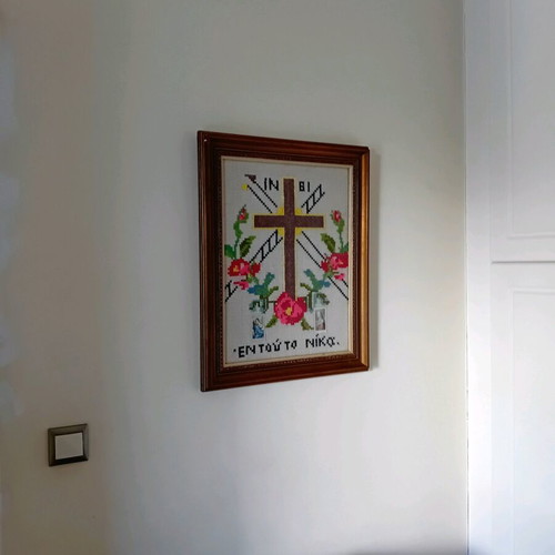 Hand-embroidered cross with wooden brown frame, like new