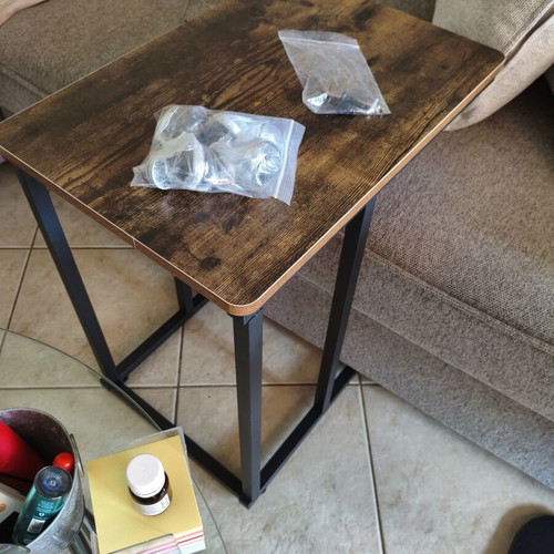 Wooden side table with metal base and wheels