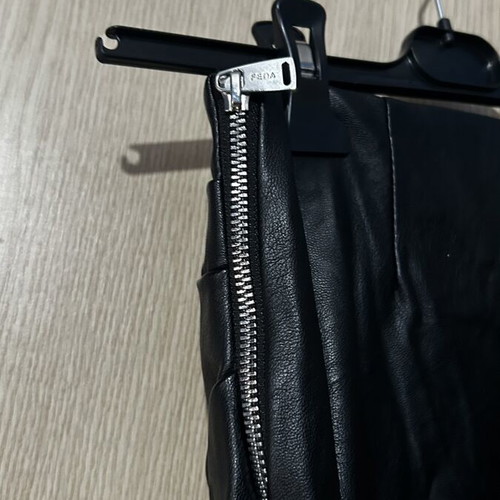 Leather mini skirt with ruching on one back side small used, black