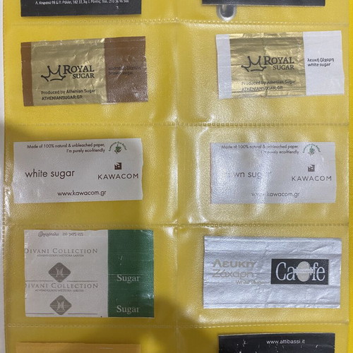 Sugar packet collection, 69 in holders plus 5 loose