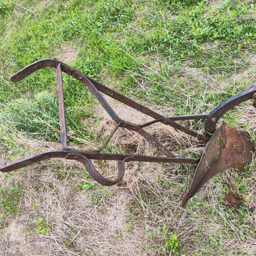 Antique plow used for garden decoration