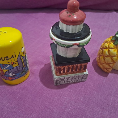 Salt and pepper shakers used, designs lighthouse, pineapple, Dubai