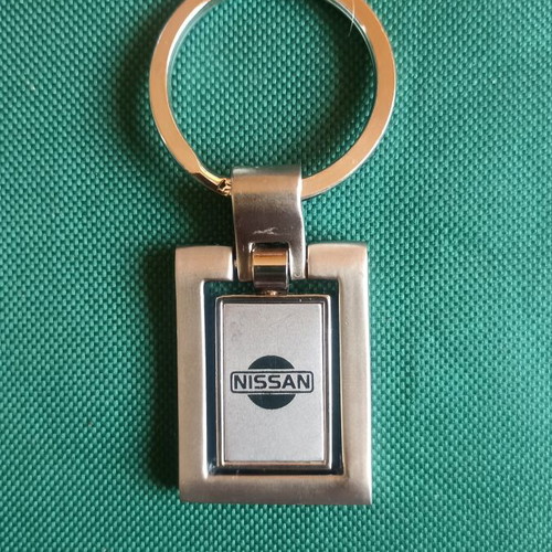 Vintage Nissan spinning keychain, New Old Stock, heavy metal 38g