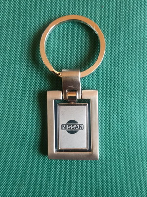 Vintage Nissan spinning keychain, New Old Stock, heavy metal 38g