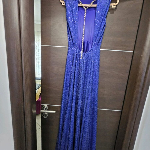Diamond blue dress like new, open back with shoulder pads