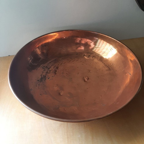 Large copper bowl used with carved details