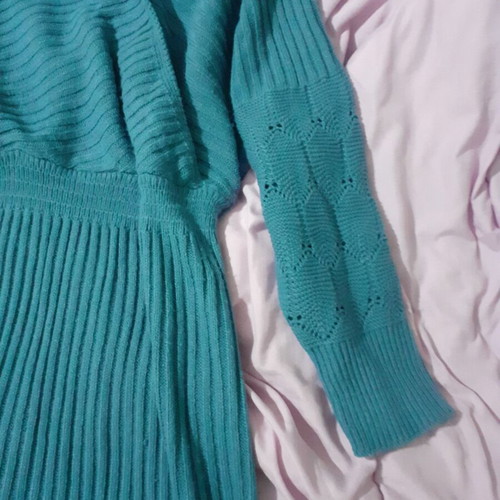 Knitted blue dress new with perforated sleeve designs and back opening size M