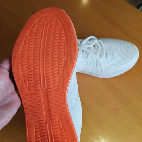 White athletic shoes like new with orange sole size 44