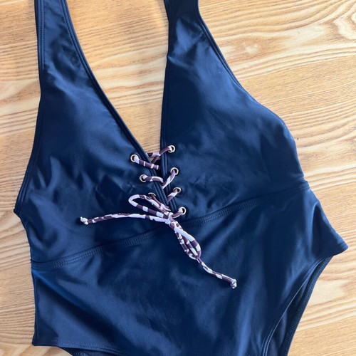 Black one-piece swimsuit with animal print cord, size L, like new