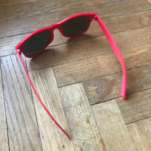 Sunglasses like new with red plastic frame