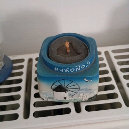 Mykonos decorative candle like new with clay holder and carved relief