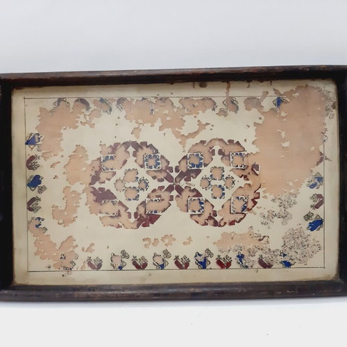 Vintage wooden tray with glass panel and painted design used