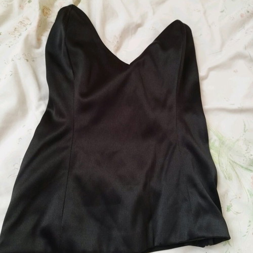 Black corset used with pointed neckline and leather look, size XS
