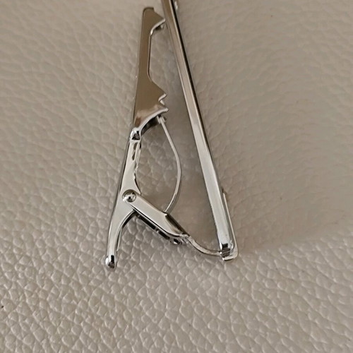 Authentic Dior tie pin new, silver with gold details