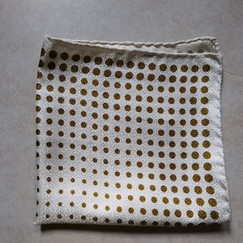 Pocket square used, white with gold dots