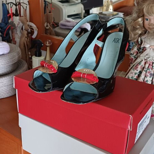 Leather summer sandals used, black with red heel and gold details