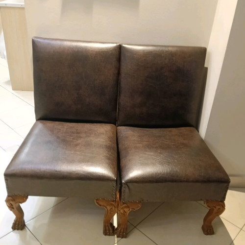 Set of two low chairs used with leatherette and wooden frame