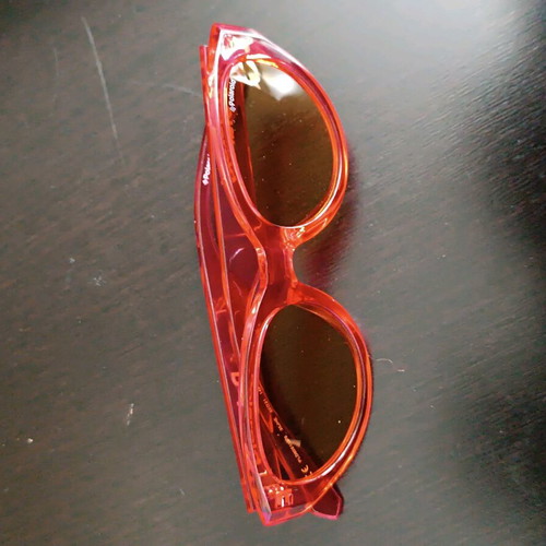 Polaroid PLD 6051/G/S sunglasses like new, transparent red with orange lens