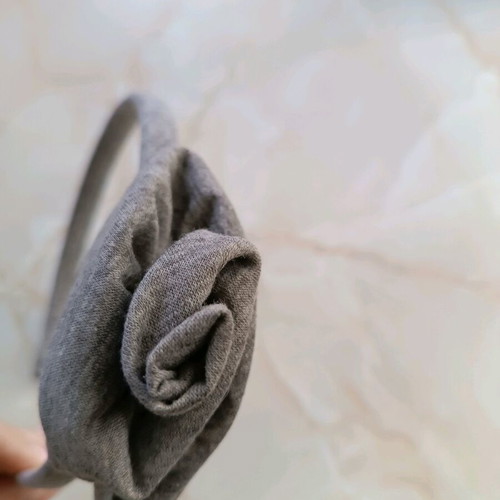 Hairband like new, grey with flower design