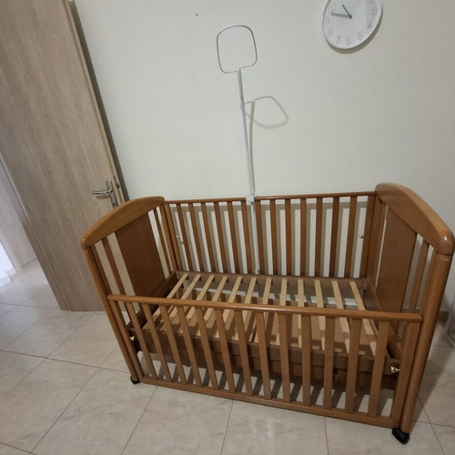 Baby cot made of solid wood with slats and drawer, like new