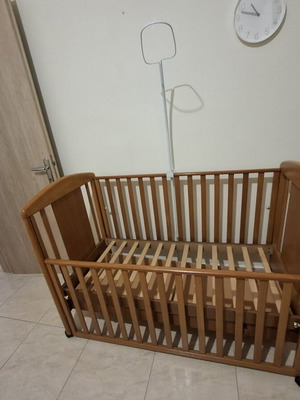Baby cot made of solid wood with slats and drawer, like new