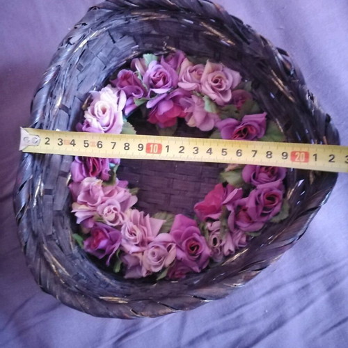 Decorative basket used with candle and floral wreath