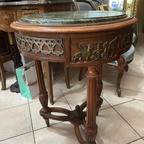 Table with bronze details and marble top used