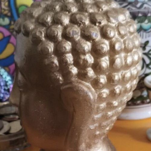 Golden Buddha bust decorative candle like new