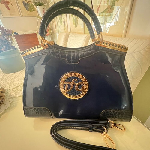 Navy Blue Lustre Handbag like new with gold metal details