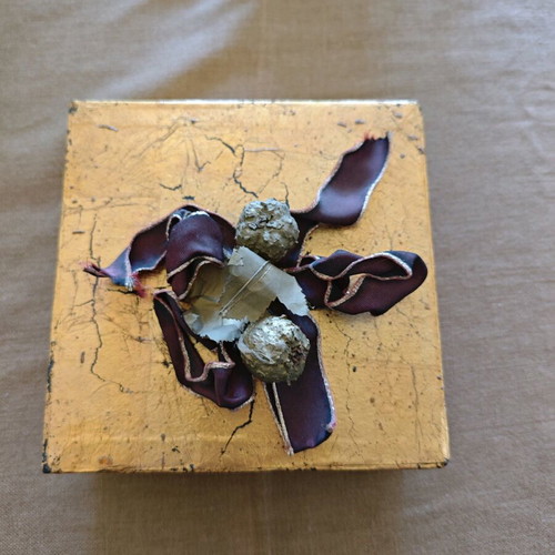 Decorative gold box like new with balls and ribbons
