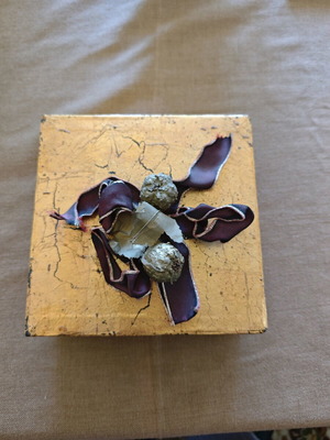 Decorative gold box like new with balls and ribbons