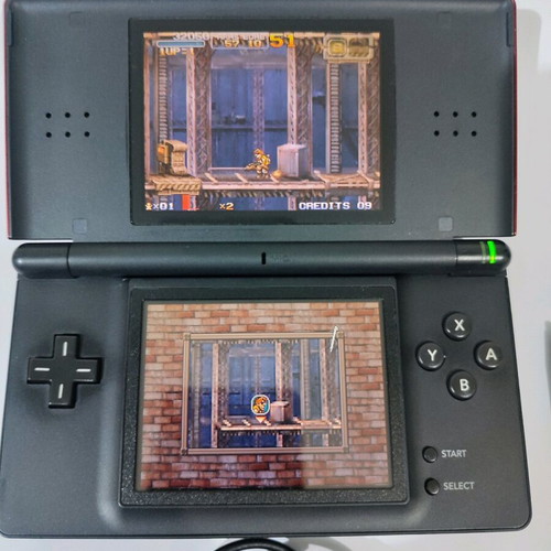 Nintendo DS Lite console used with Pokemon LeafGreen cartridge and accessories