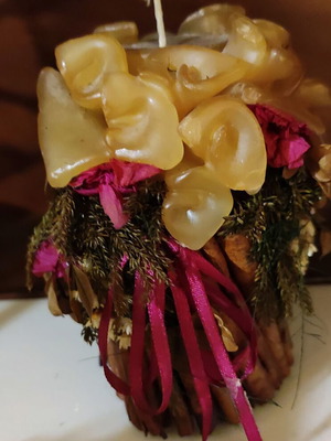 Handmade candle used with embossed flowers and dried decorations