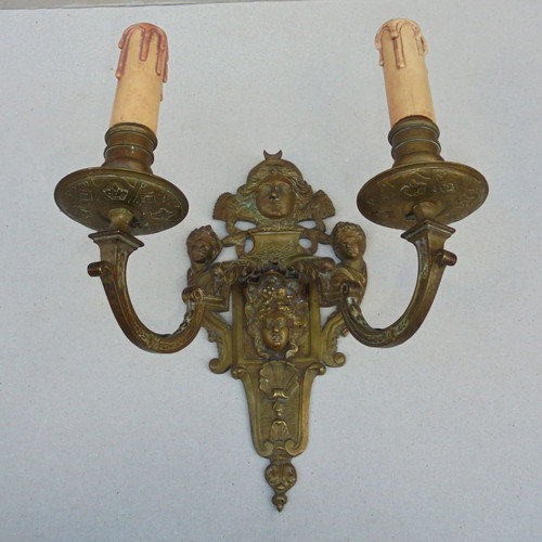 Pair of bronze antique two-light wall sconces, late 19th century