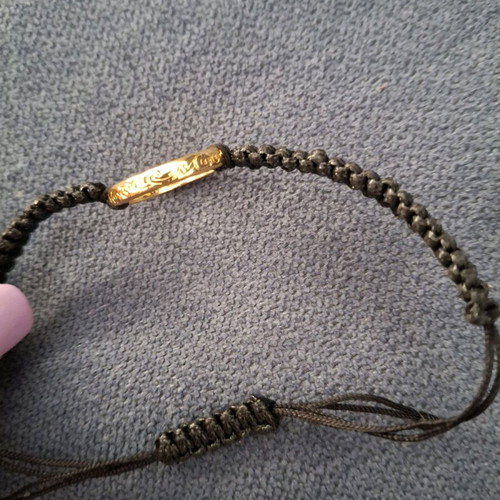 Bracelet like new in black color with gold details