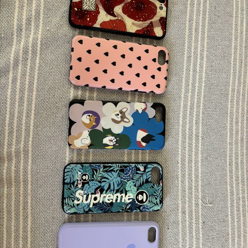 iPhone 7 with 5 cases and 3 screen protectors