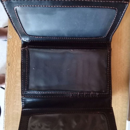 Women's black wallet used with photo and money slots