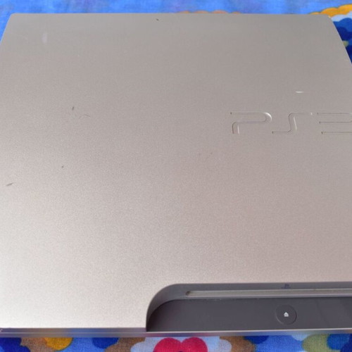 PlayStation 3 Slim 320GB Satin Silver console used with cables and controller