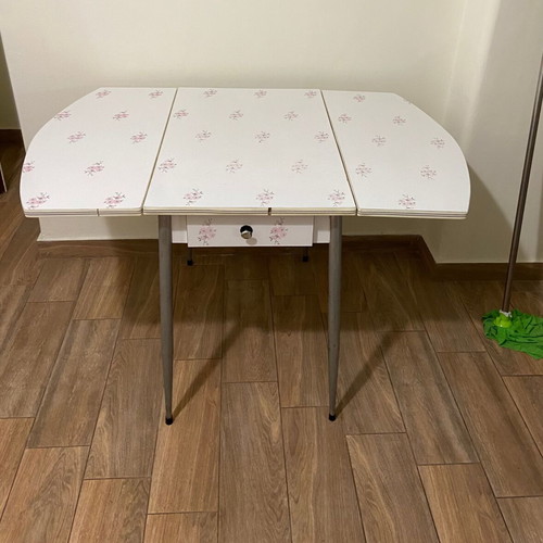 Formica kitchen table used, extendable with almond blossom design and drawer