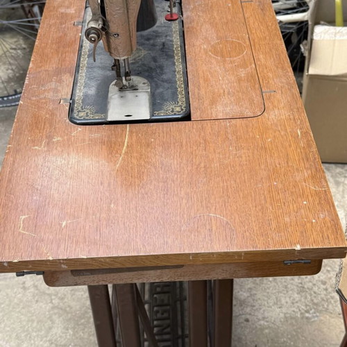 Singer sewing machine used with cabinet