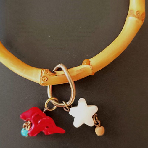Bamboo bangle with tiki charms like new