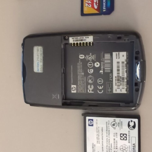HP iPAQ HX2490b PDA used with charging dock and accessories