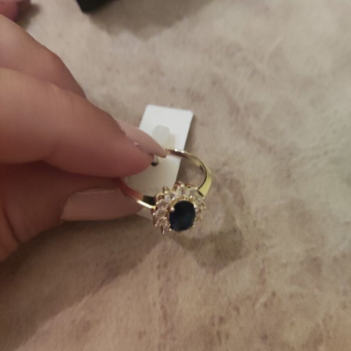 Women's rosetta ring new, gold color with blue oval stone and zircons