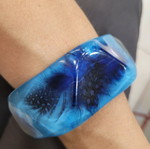 Bracelet with embedded feathers like new