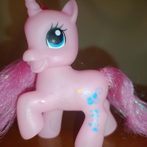 Pink My Little Pony Style Unicorn figure used with glitter hearts