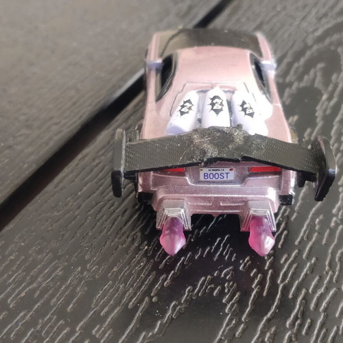 Disney Cars Boost 1:55 scale used with glued spoiler and bent wheels
