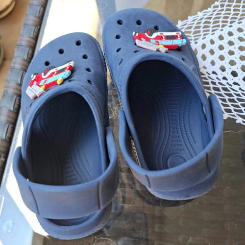 Kids Cros slippers size 25 like new, blue with fire truck figure